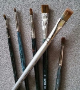 The Green brushes are 20 years old and the silver one is new